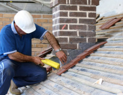 carpenter fixing chimney