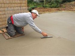 carpenter cementing the floor